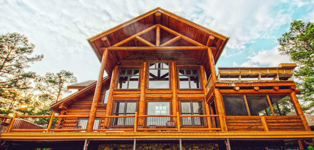 Ground up view of an off grid log cabin