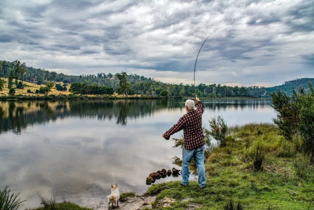 Man casting off into river