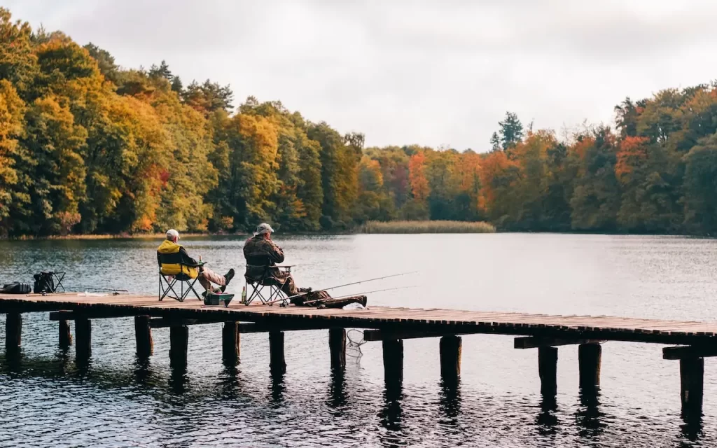 2 genetlemen fishing on dock